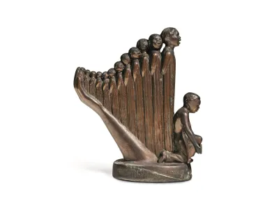 A bronze sculpture of several figures rising out of a bent arm as if in a harp. 