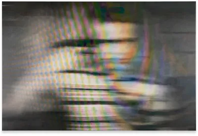 A pixelated, blurry image of person moving.
