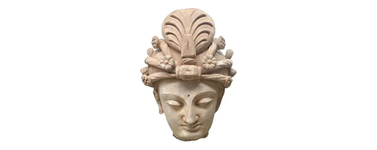 The elaborately decorated head of a Bodhisattva statue dating back to the 2nd or 3rd century that was seized as part of multiple investigations into the trafficking of antiquities from Pakistan.