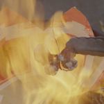 A film still shows prongs holding a butterfly over a fire.