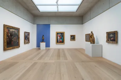 A gallery filled with paintings and sculptures.