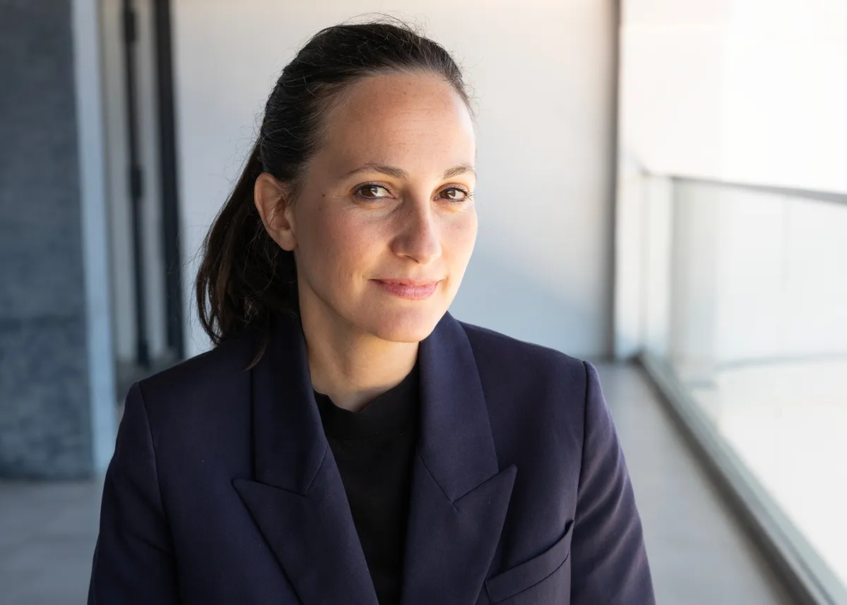 Close-up portrait of Hanneke Skerath in a navy blazer.