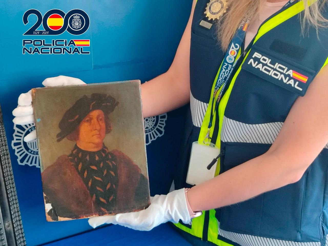 A Spanish police officer presents a forged painting that was claimed to have been by Leonardo da Vinci.