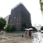 Pedestrians walk past the old Harris County District attorneys office building, 201 Fannin, September 21, 2018 in Houston. (Photo by Steve Gonzales/Houston Chronicle via Getty Images)