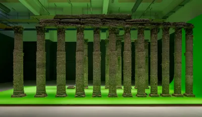 A reconstruction of a colonnade on a green screen.  