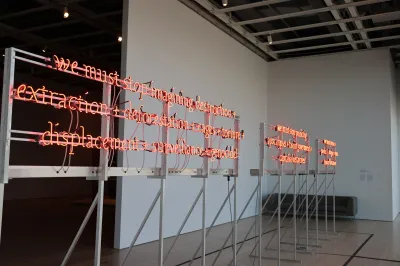 A light sculpture that reads, in part, 