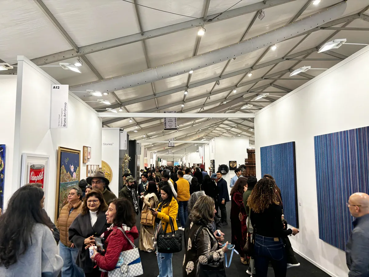 The crowded aisles of an art fair.