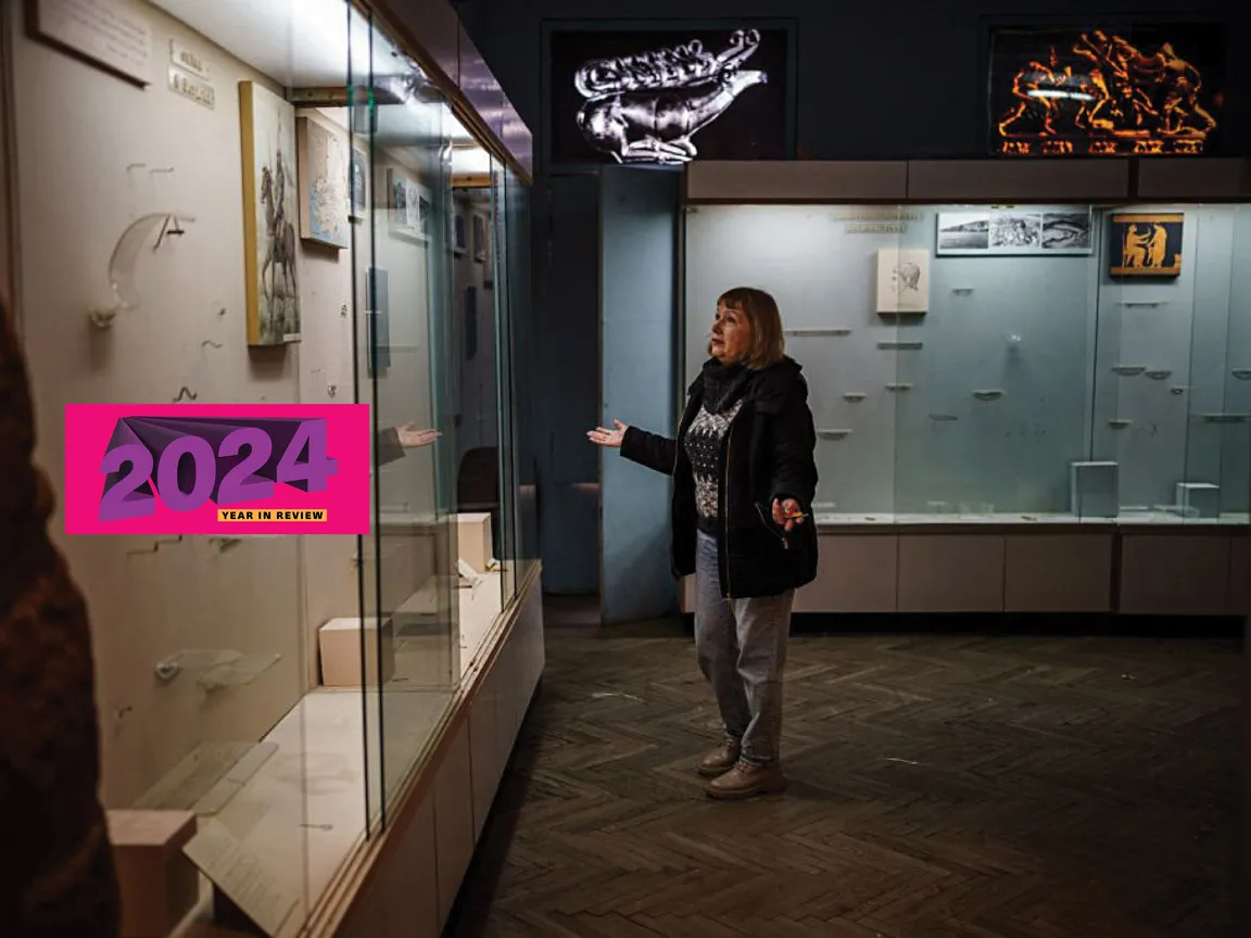 Olga Honcharova, temporary director of the Kherson Regional Museum, shows shows an empty glass display cases in Kherson.