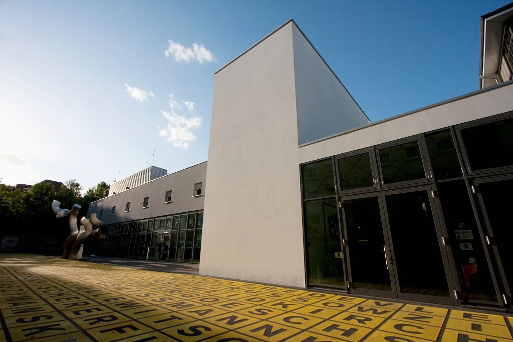 Forecourt Of Berlinische Galerie With Shining Yellow Field Of Letters On Black Asphalt, The Berlin State Museum, Berlin, Germany (Photo by: Insights/Universal Images Group via Getty Images)