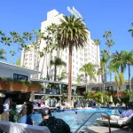 View of the pool of the Hollywood Roosevelt Hotel with the tower in the background.