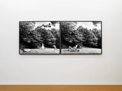 A photocollage showing a fornicating Black woman and white man floating above a field where Black children play below.