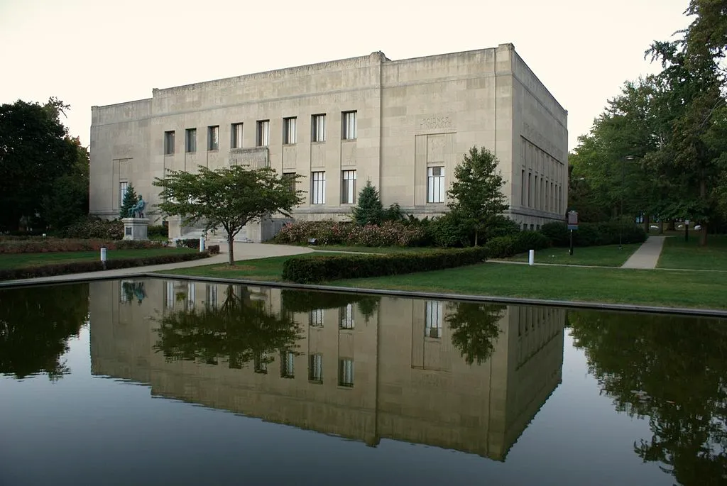 A front view of the Everhart Museum in Scranton, PA, including its reflecting pool, where two of the crime ring