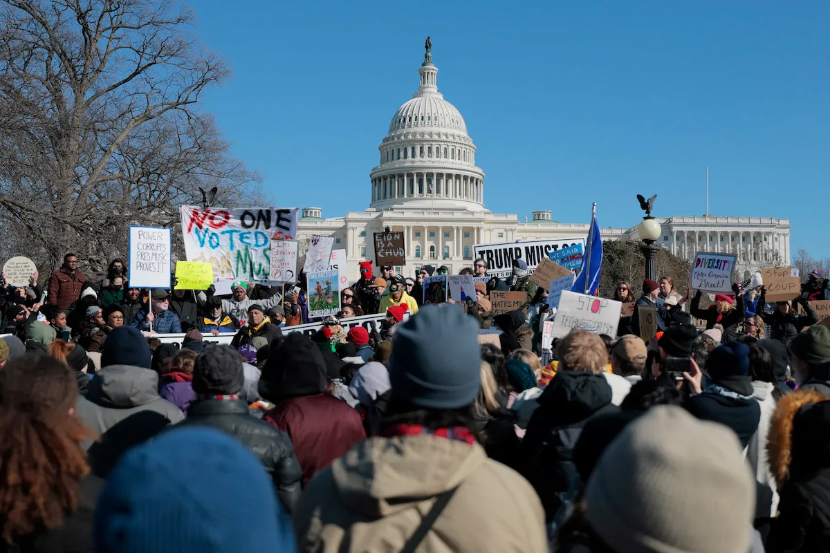 A group of people protesting in front of the White House.